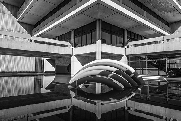 black and white picture of the rainbow sculpture at the back of Scott Library