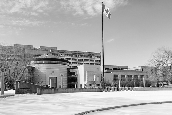 black and white photo of Vari Hall and the flag pole